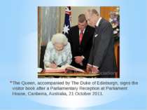 The Queen, accompanied by The Duke of Edinburgh, signs the visitor book after...
