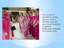 The Queen is greeted by nurses during a visit to officially open the new Roya...
