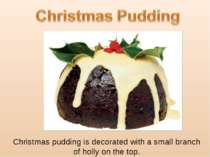Christmas pudding is decorated with a small branch of holly on the top.