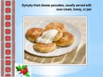 Syrnyky-fried cheese pancakes, usually served with sour cream, honey, or jam